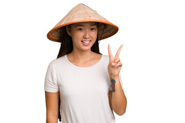Young asian woman wearing a Vietnamese hat isolated showing number two with fingers.