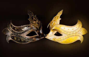 Yellow and dark New Year's masks on a dark background.