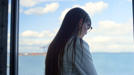 Disappointed woman thinking window in suit closeup. Pensive businesswoman fired