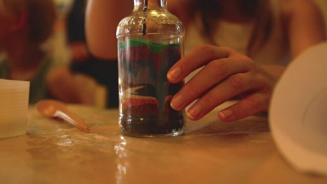 Colored Sand In A Glass Bottle, An Ideal Therapy Tool For Children