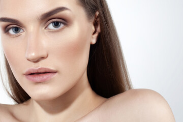 Fototapeta premium Beautiful caucasian girl with perfect skin and natural makeup on white background