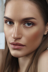 Fototapeta premium Beautiful tanned girl with perfect straight dark hair. Perfect skin, natural makeup