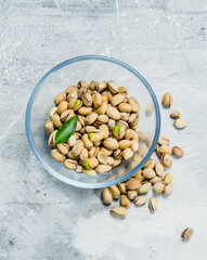 Pistachios in a glass bowl.