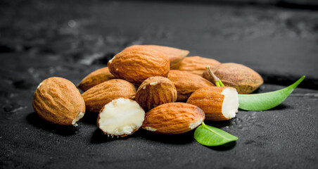 Almonds with green leaves.
