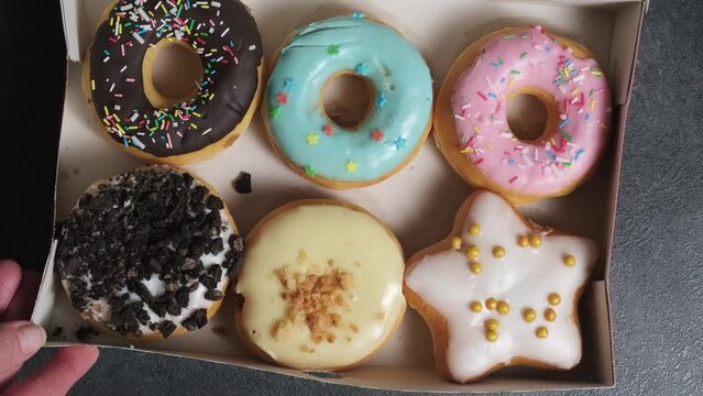 a box with a set of different donuts