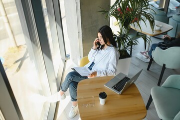 Smiling girl student study online with skype teacher, happy young woman learn language listen...