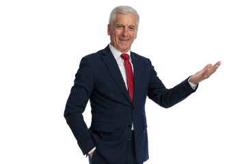 businessman putting one hand in pocket and greeting