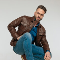 casual man resting his arms and posing sexy