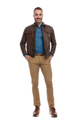 full body picture of handsome man with brown leather jacket smiling