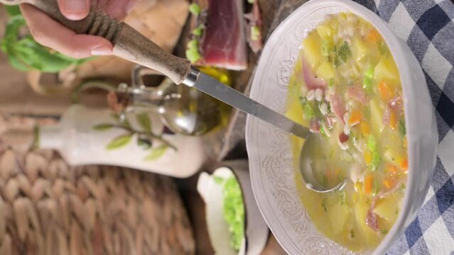 barley soup, zuppa di orzo. Zuppa tradizionale con pancetta e orzo nel nord italia, Trento. Cucina contadina, tipica delle Alpi. High quality 4k footage