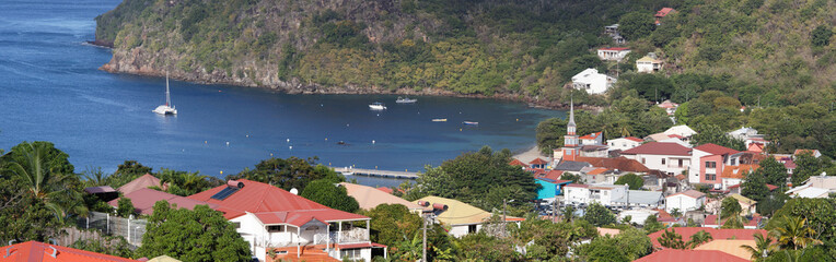 Panoramic view of village and cove at Les Anses-d'Arlet village , Martinique island.