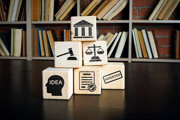 Copyright or patent law concept. Wooden cubes with marks on the desk. - obrazy, fototapety, plakaty