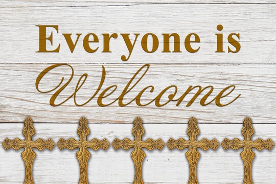 Everyone is welcome message with bronze religious cross on wood