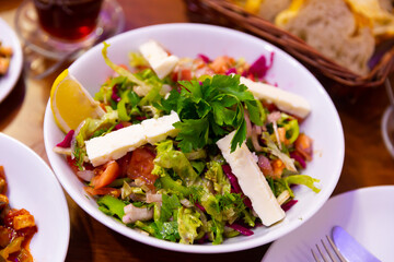 Light vegetable salad Choban with cheese in a Turkish cafe.