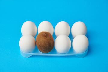 Hairy kiwi among smooth eggs, male depilation concept