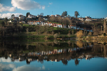 Reflection of houses in the Douro River, Portugal.