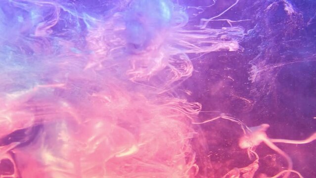 Ink shot. Fluid splash. Haze texture. Pink purple neon color light shiny glitter paint explosion mist cloud motion abstract background.