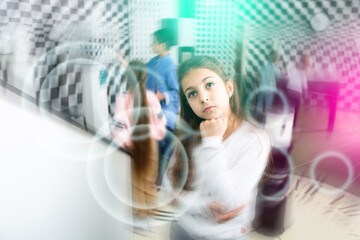 Obraz premium Pensive girl trying to find solution of conundrum to get out of quest room