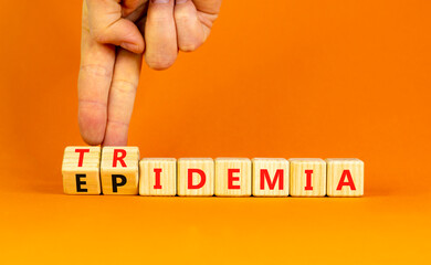 Covid-19 epidemic or tridemic symbol. Concept word Epidemic and Tridemic on wooden cubes. Doctor...