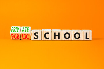 Public or private school symbol. Concept word Public school Private school on wooden cubes. Beautiful orange background. Education Public or private school concept. Copy space.