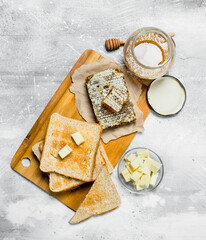 Breakfast. Toasted bread with butter and honey.