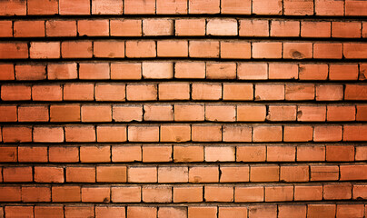 Obraz premium Brick wall, old texture of red stone blocks closeup.