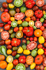 colorful tomatoes on the wooden background