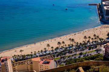  landscape from above on the beaches of playa del postiguet on a sunny day sand water people leisure