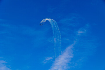  flight of five cessna planes over alicante smoke spanish flag against the blue sky