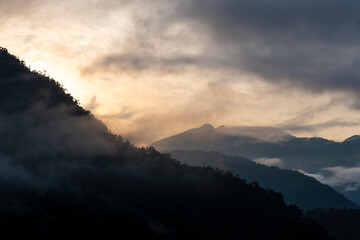 Cloud forest sunrise with Andes mountains in background, Mindo Tandayapa cloud forest, Quito region, Ecuador.