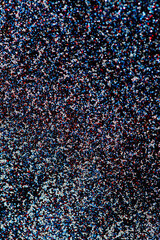 holiday background, glitters on the black background