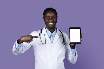 Friendly african american doctor holding digital tablet with white screen