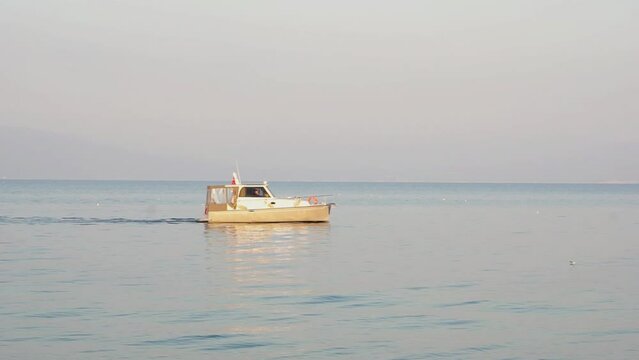 Boat sailing alone in the sea. 