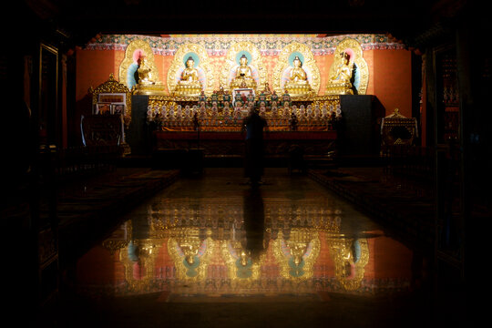 A Buddhist monk prays in a Buddhist monastery near Kathmandu, Nepal
