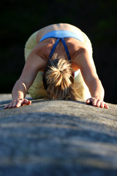 Young woman doing yoga in Squamish, BC, Canada.