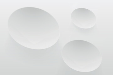 a white circles with shadows on wall