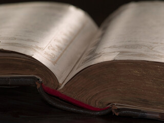 Books with community records amidst other memorabilia in the museum section of a historic Jewish Synagaogue in Tucson, Arizona.