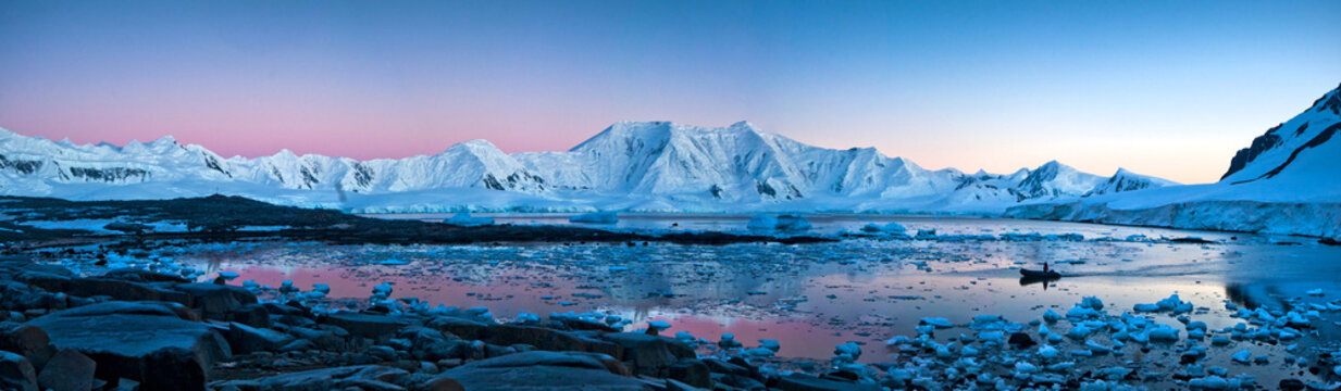 A zodiac sent from the main ship comes to pick up passengers that bivouaced (slept) on the continent of Antarctica at sunrise.