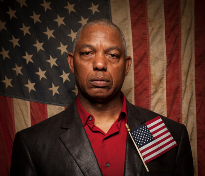 A man  poses for a portrait as a first time voter in the November 2012 United States Presidential Election for a project on new amercian voters.