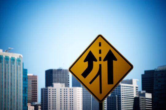 Directional road sign with the San Francisco skyline in the background. California.