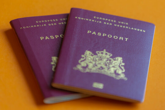Traveling document and immigration concept, Selective focus of Dutch passport (Nederlands paspoort) are issued to citizens of the Kingdom of the Netherlands for the purpose of international travel. 