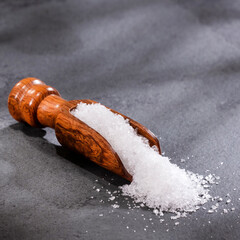 Magnesium chloride in wooden spoon - healthy fine crystals