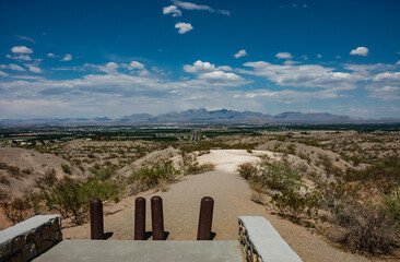 A Hiking and Biking Trail in the Desert Mountains with an Aerial View of the Town