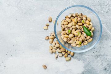 Pistachios in a glass bowl.