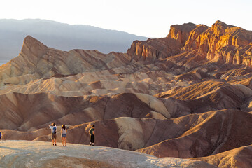 Zabriskie Point with people at sunset