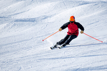 Fototapeta na wymiar People are having fun in downhill skiing and snowboarding