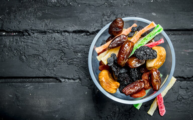 Different dried fruit in a bowl.