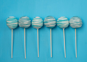 Teal and white cake pops