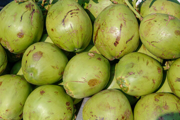 Stack of coconut exposed in outdoor market stall. Sao Paulo, Brazil