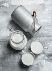 Milk in mugs with a can.